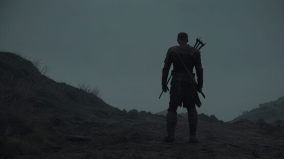 صراع البطل مع المجهول The_wary_warrior_struggles_against_the_unknown_his_back_to_camera