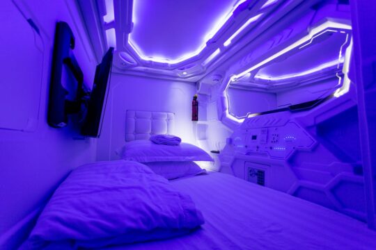  فندق كابسولي في اليابان Capsule Hotel Photo by Tomáš Malík: https://www.pexels.com/photo/interior-of-creative-illuminated-capsule-hotel-4090093/